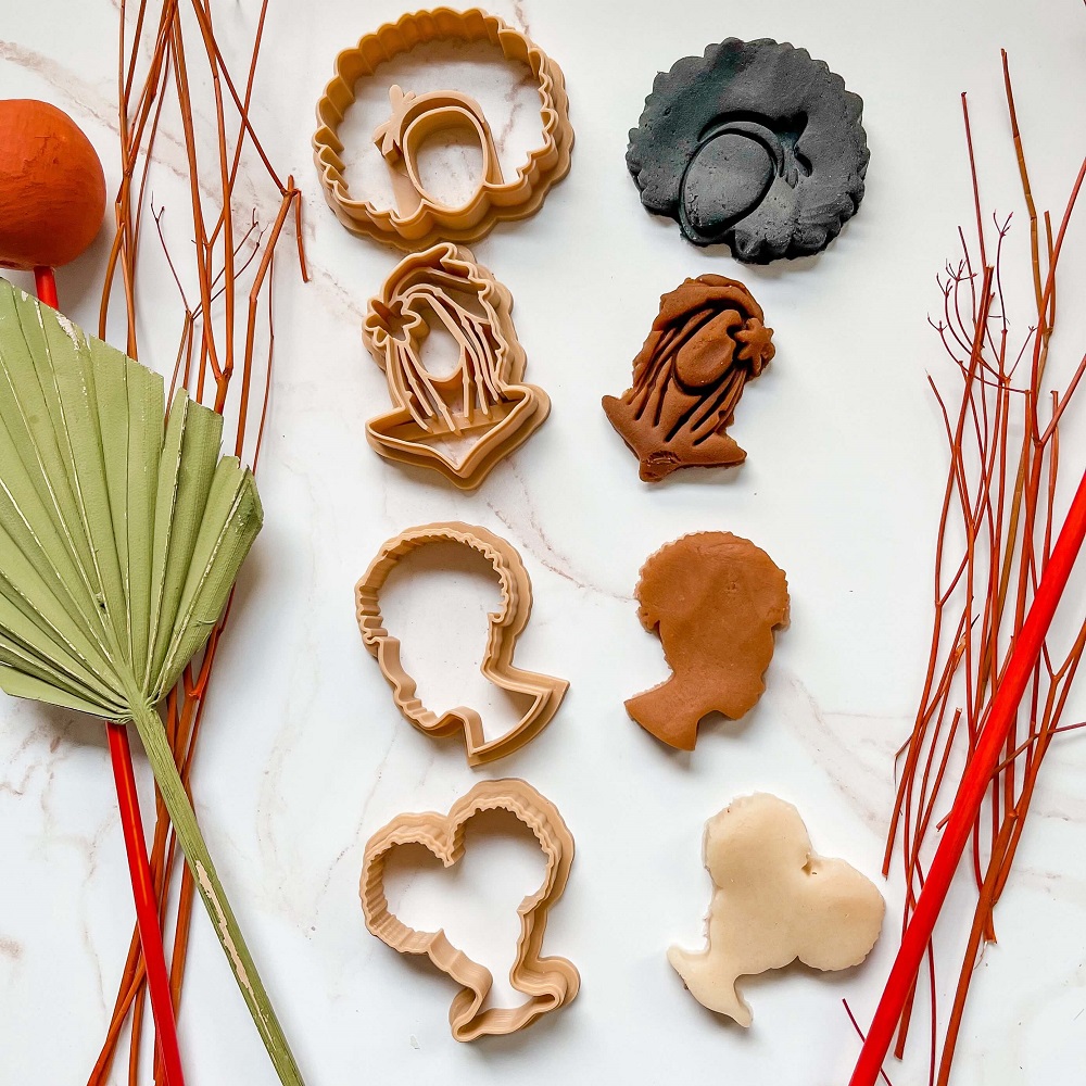 black hair play dough cutters with nude colored play dough