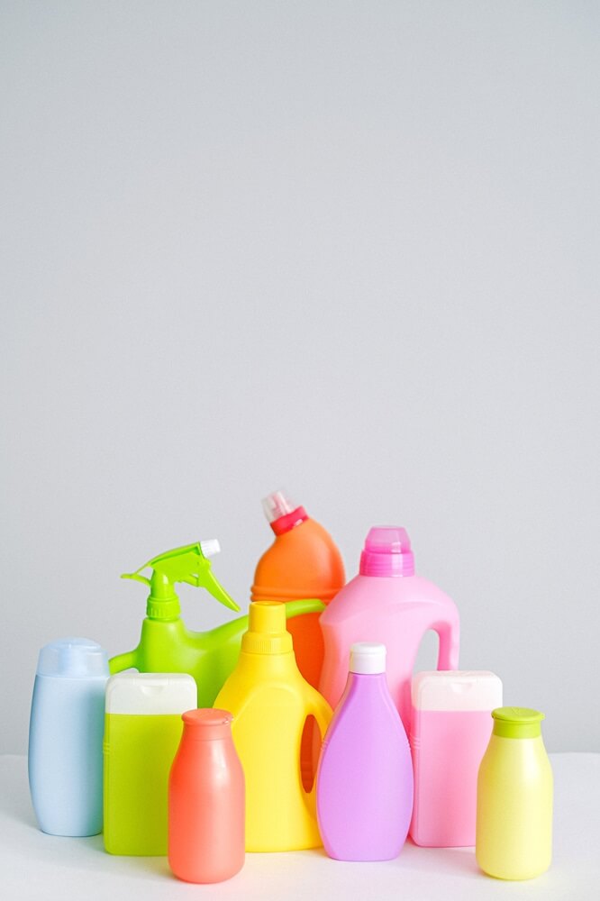 colorful cleaning supply bottles (using aesthetically pleasing products are a great way to make decluttering fun!)